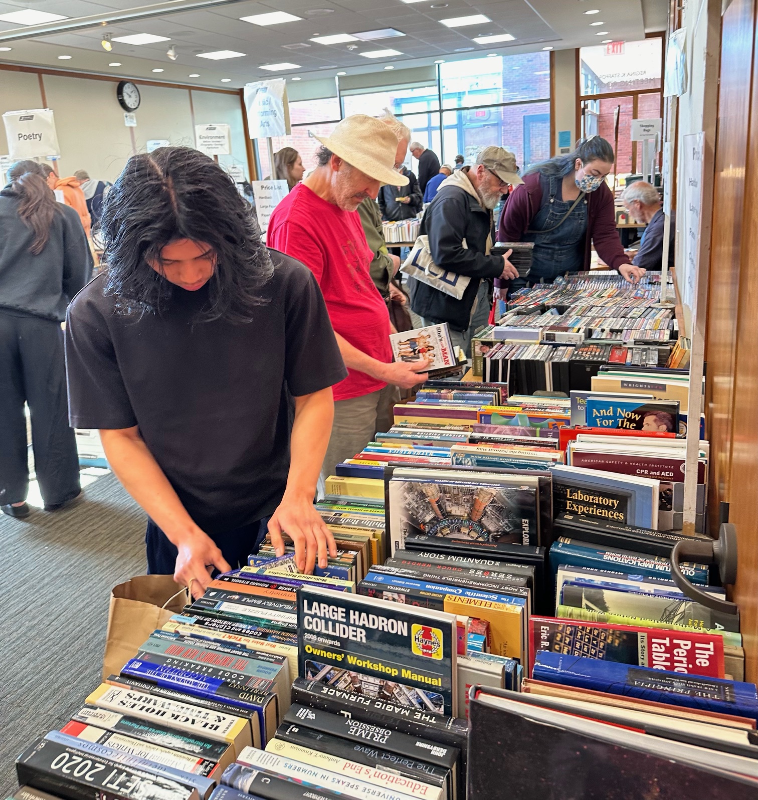Customers at the Used Book Sale looking through the used book selection.