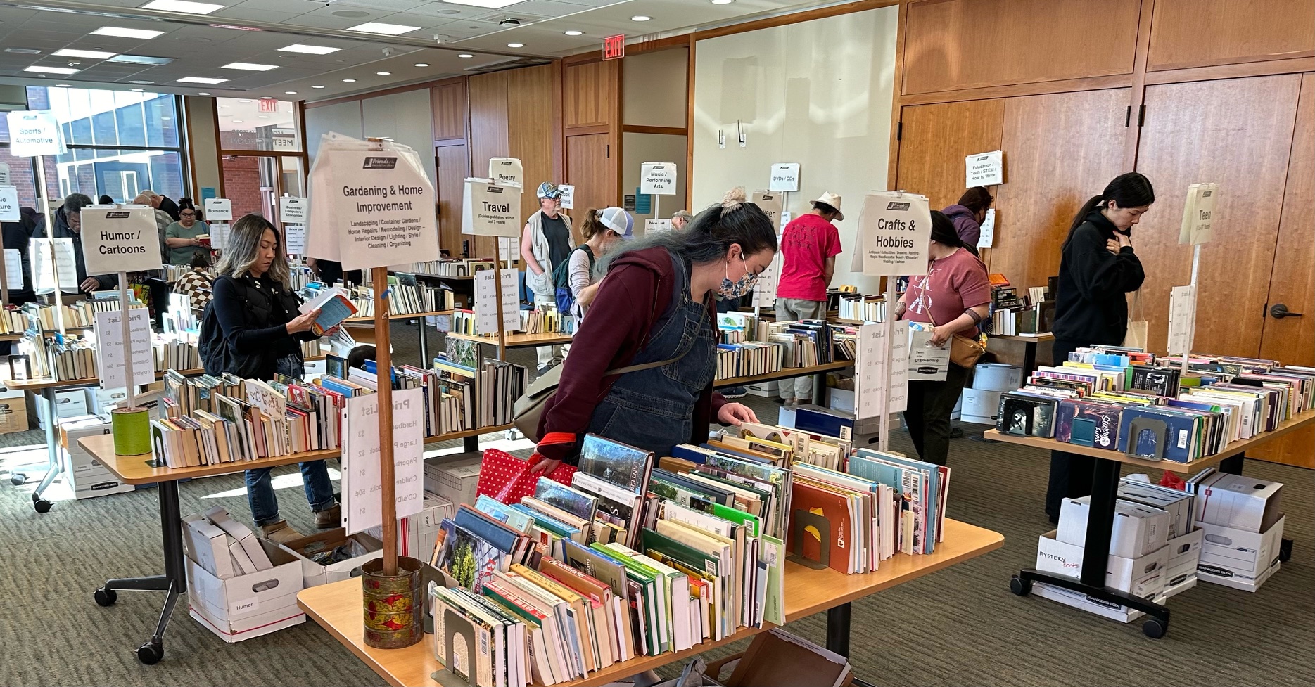 Customers at the Used Book Sale looking through the used book selection.