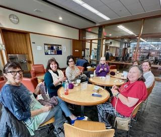 Volunteers sitting at Books and Bites cafe.